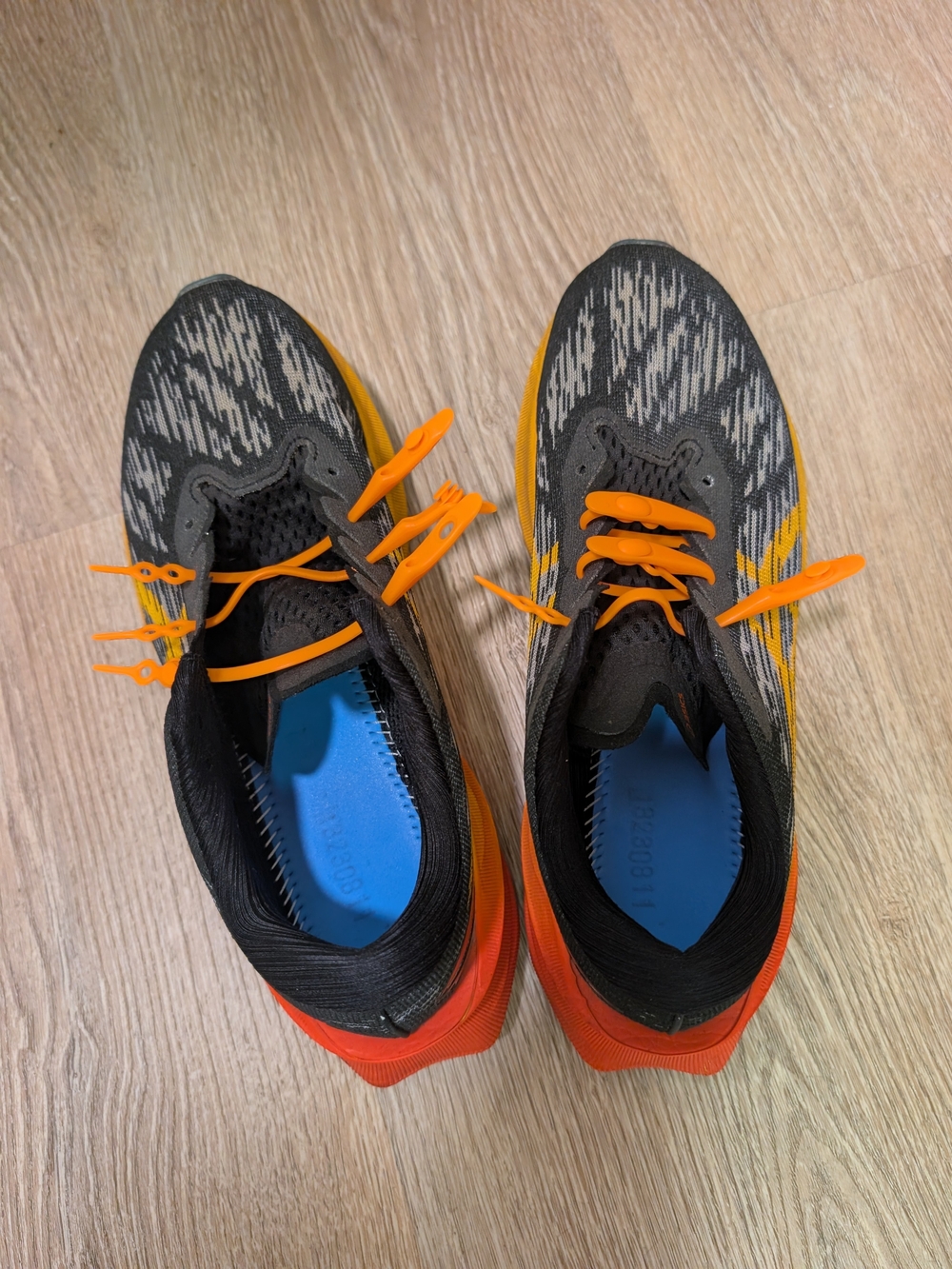 Men's Asics Novablast 3 Running Shoes in Black and Orange